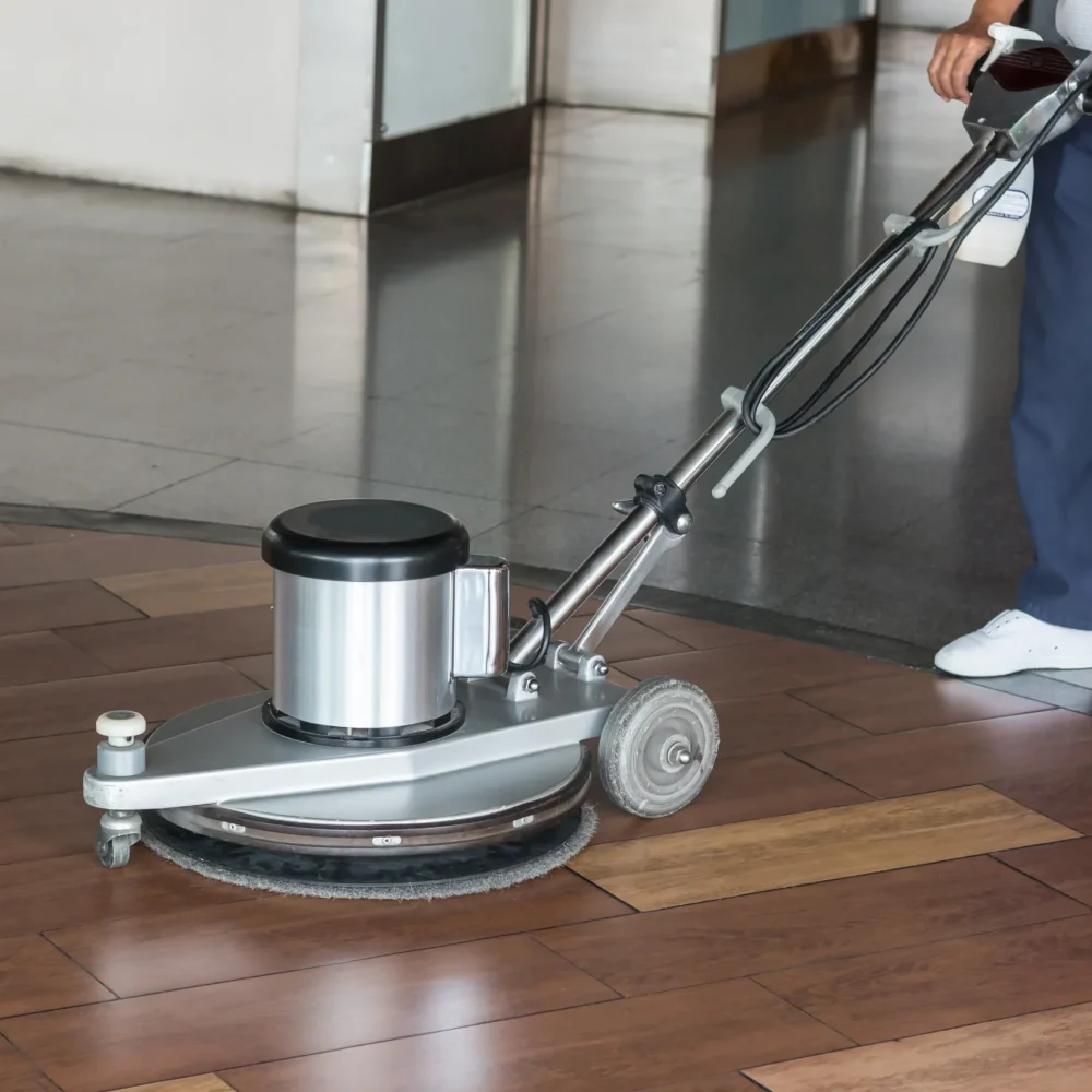 woman-worker-cleaning-floor-with-polishing-machine
